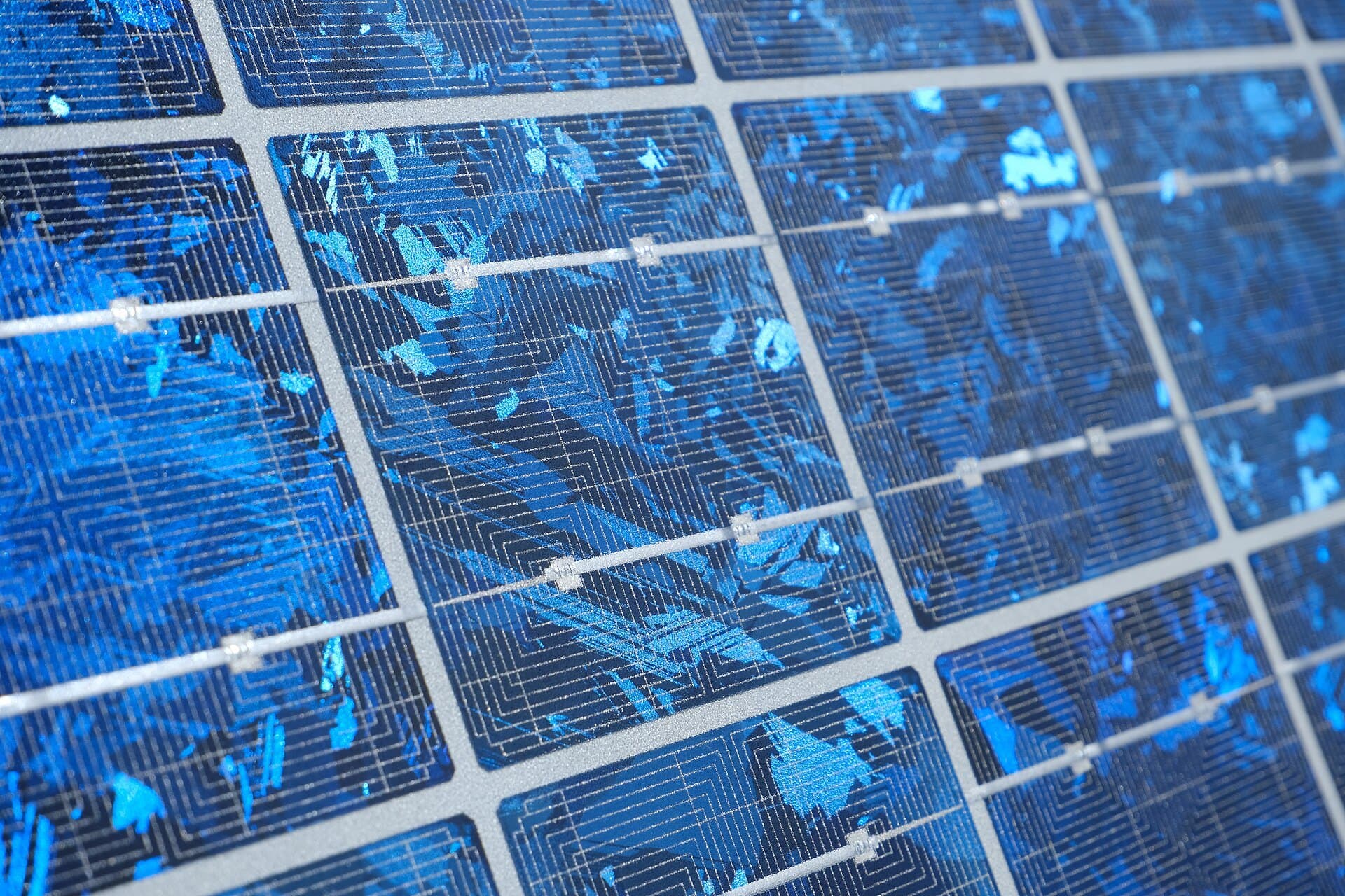Close-up of a polycrystalline silicon solar panel showing its crystal pattern