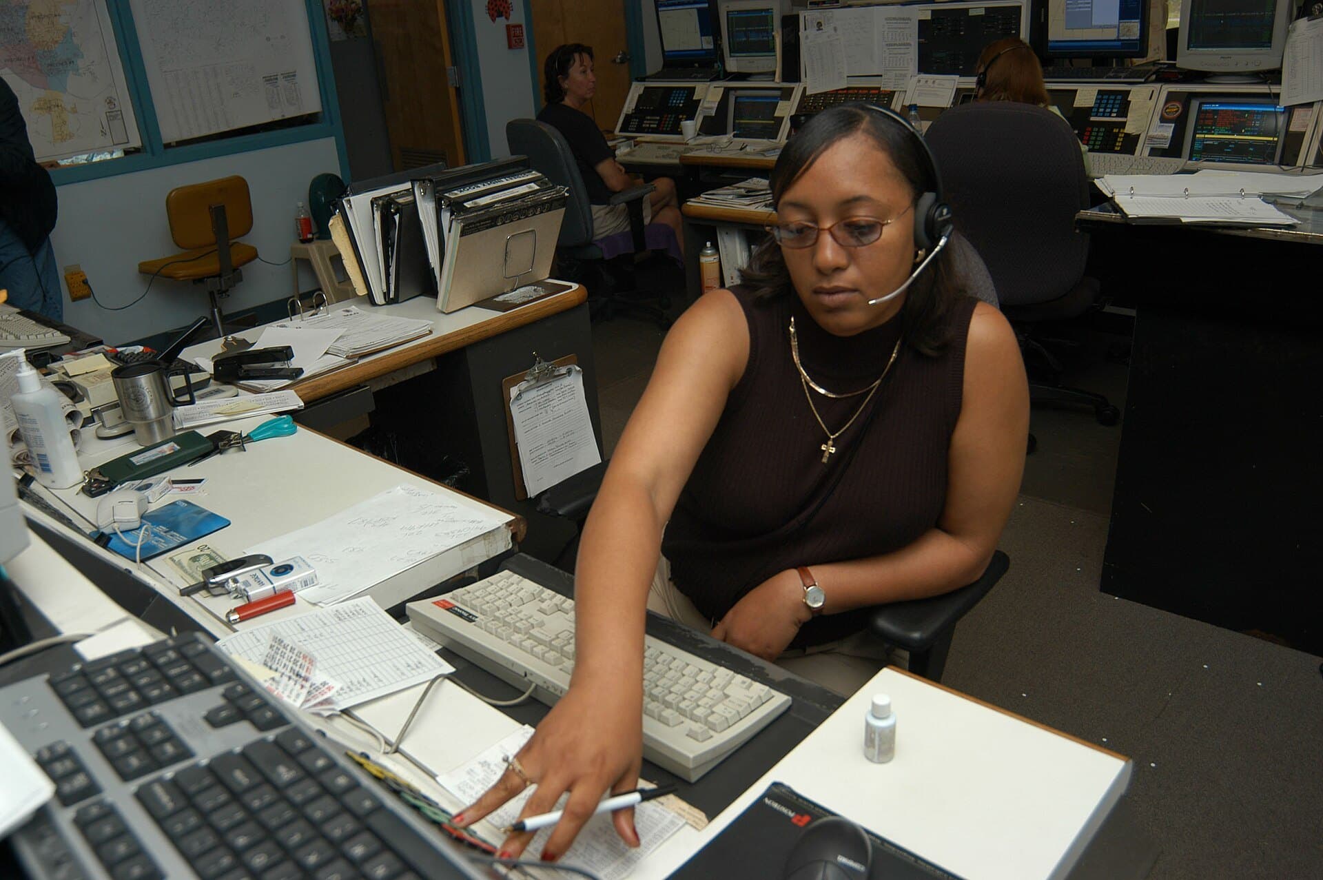 A dispatcher takes a call at the Jackson, Tennessee, 911 dispatch center (FEMA photo, 2003)