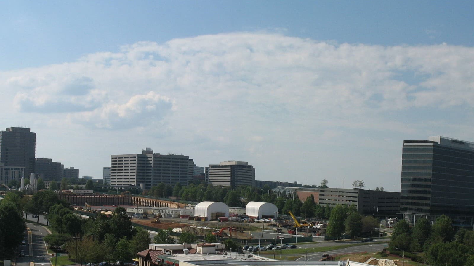 Tysons Corner skyline, Fairfax County, Virginia (2009 file photo). Photo: BenjPHolm via Wikimedia Commons (Public domain).