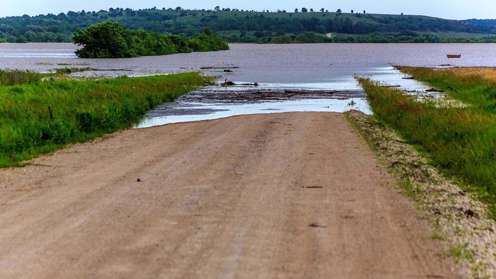 A road and bridge under water after heavy rain in Marshall County, Kansas, June 2015 (file photo, illustrative; not current flooding).