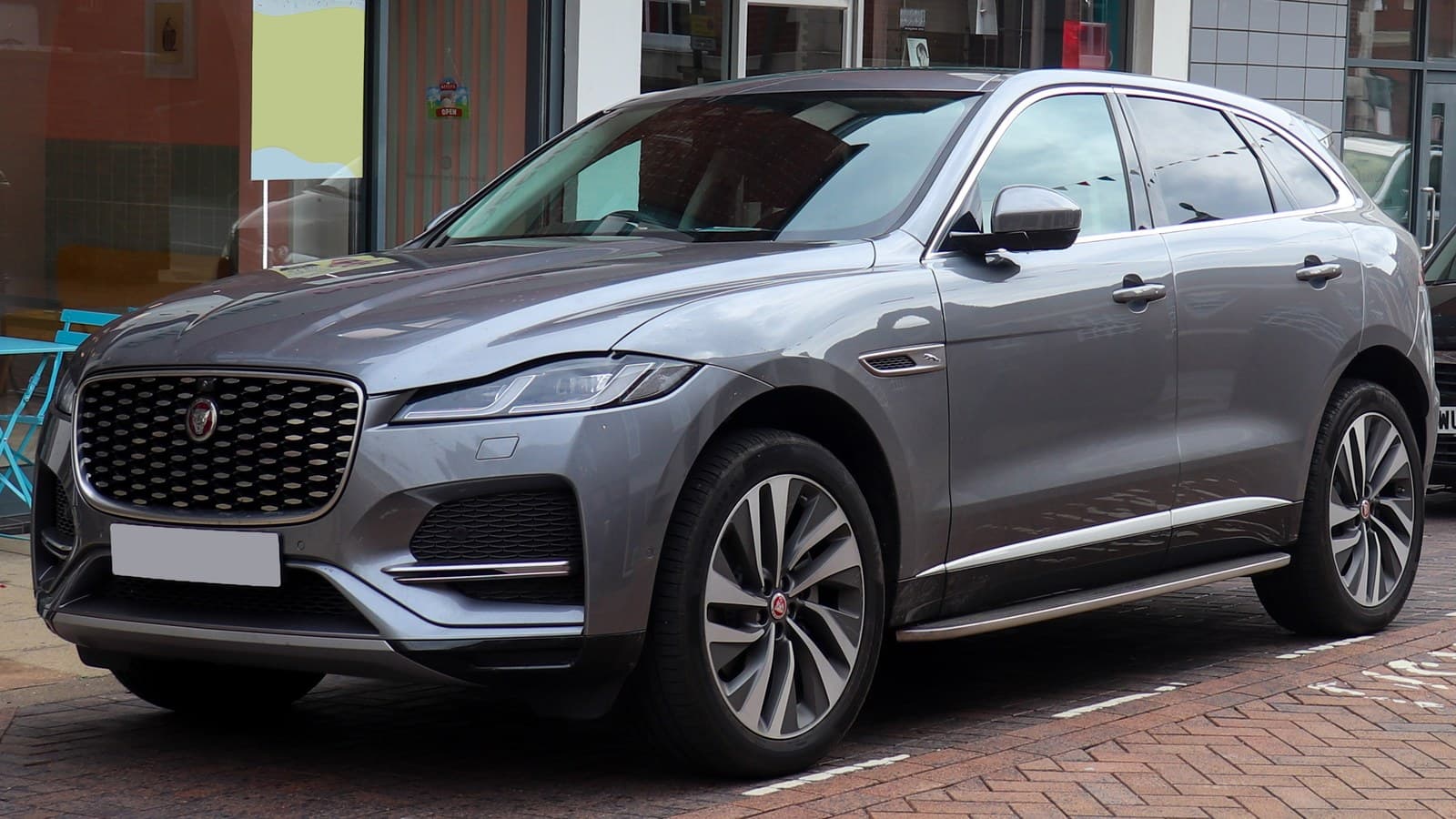 Grey 2021 Jaguar F-Pace HSE mild-hybrid SUV parked on a street, seen from the front left